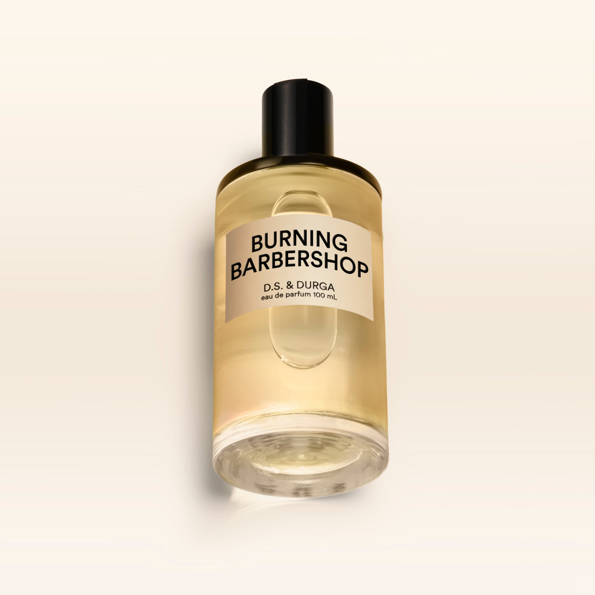 A 100 mL bottle of Burning Barbershop perfume.