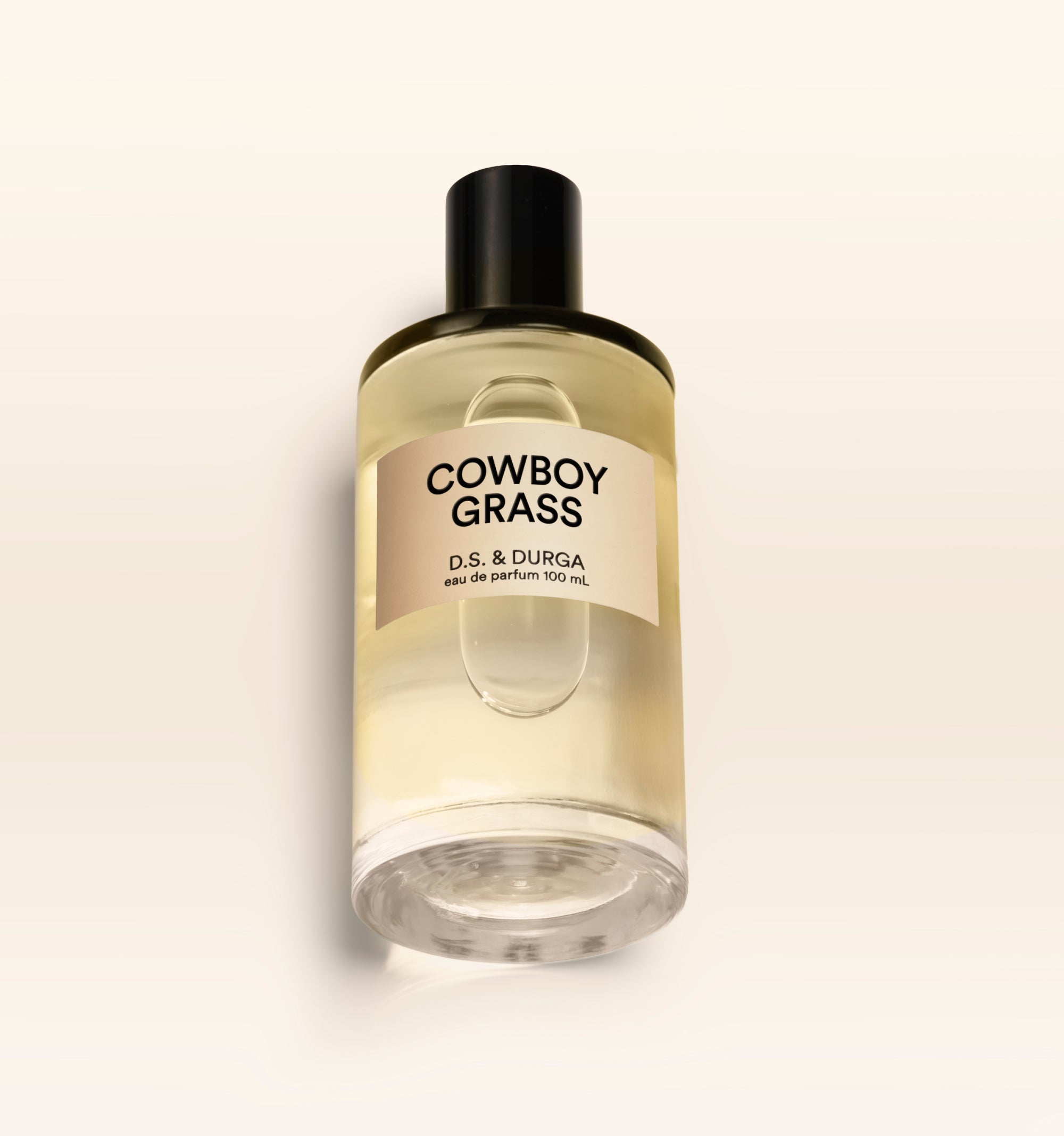 A 100 mL bottle of Cowboy Grass perfume.