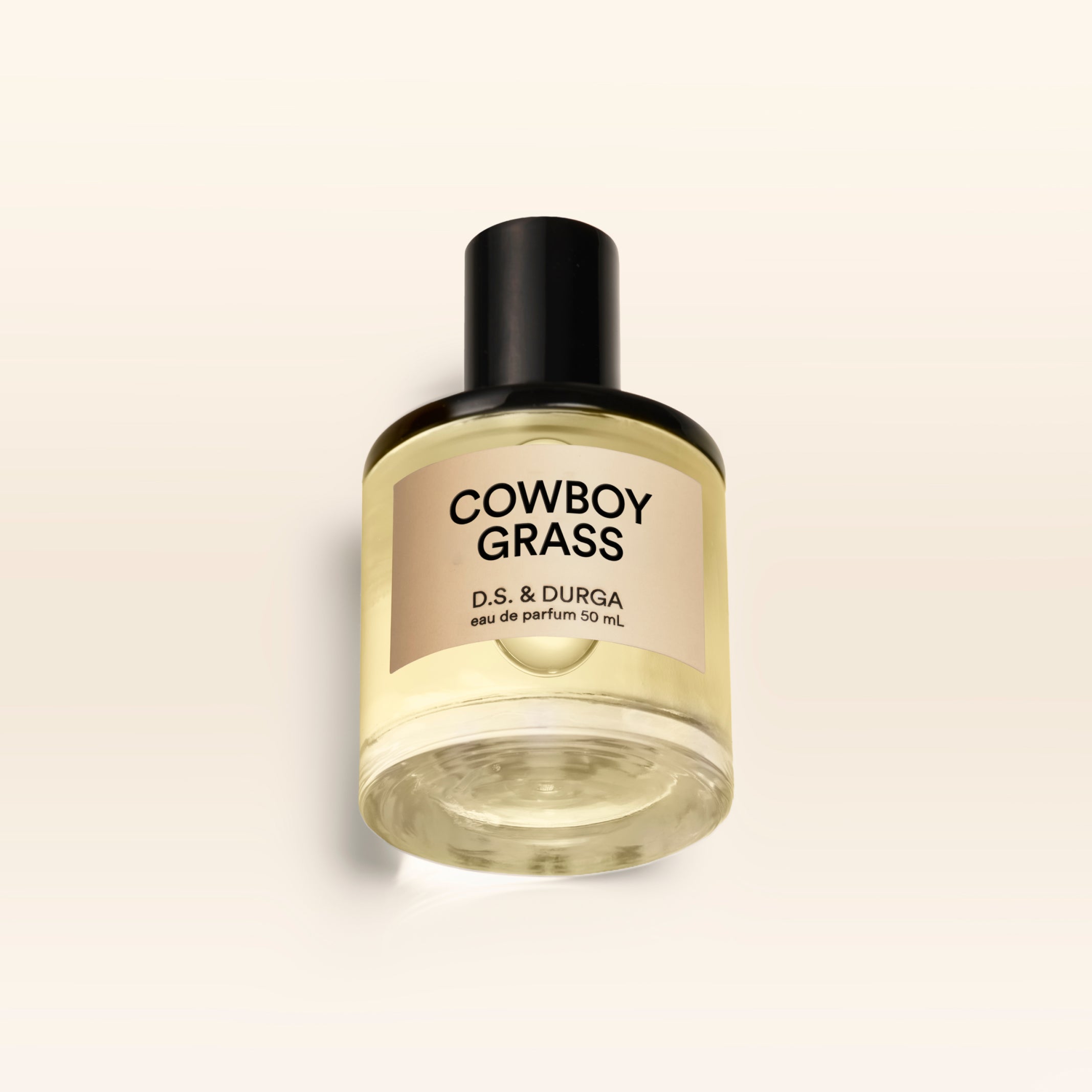 A 50 mL bottle of Cowboy Grass perfume.