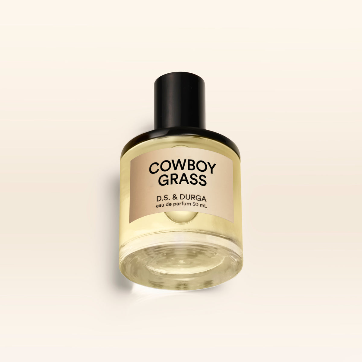 A 50 mL bottle of Cowboy Grass perfume.
