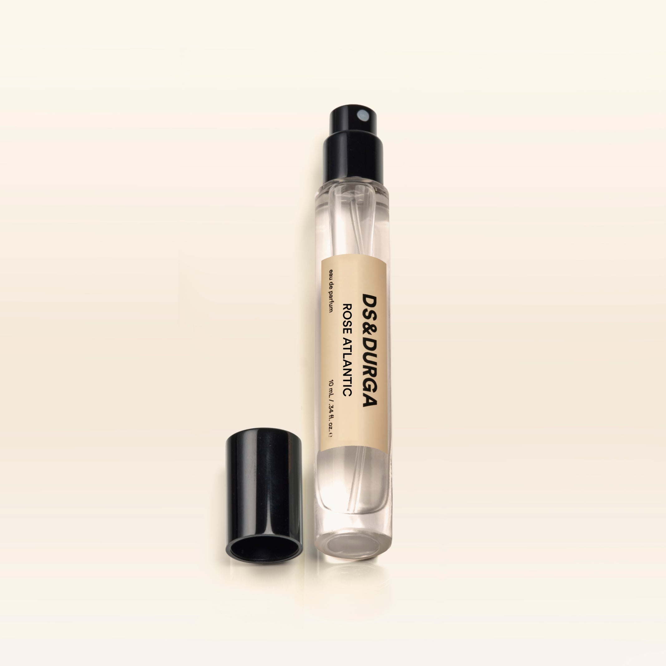 A travel size bottle of Rose Atlantic perfume